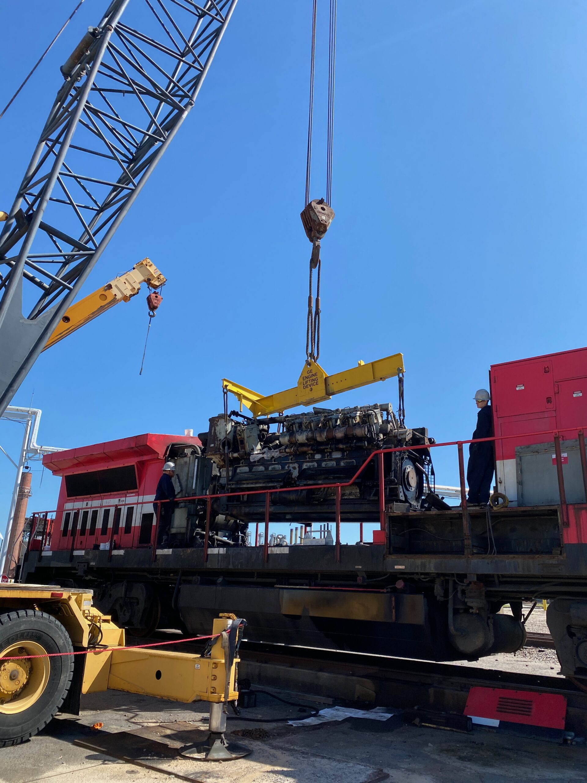 GE 7FDL engine hoisted on crane for prime mover replacement